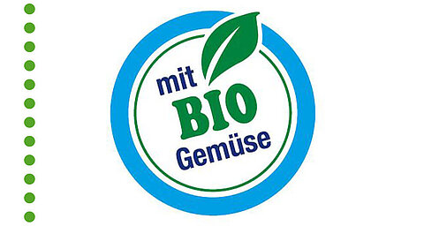Ein kreisförmiges blau-weißes Logo mit einem grünen Blatt und dem Text "mit BIO Gemuse" im Inneren.