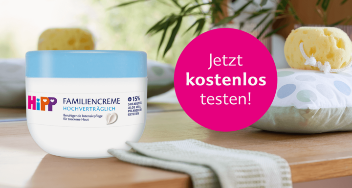 Ein Tiegel mit der Feuchtigkeitscreme "Hipp Familiencreme", mit einem rosa Banner im Hintergrund, das für einen Test des Produkts wirbt.