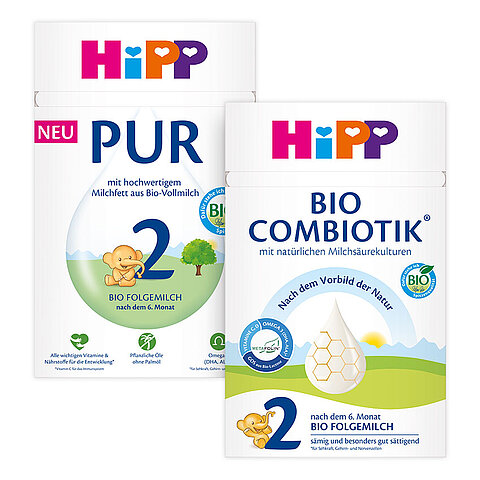 Zwei Verpackungsetiketten für Babyprodukte. Das linke Etikett ist für 'BIO Folgemilch' mit der Beschreibung 'nach dem 6. Monat" und "ideal im Belkostalter". Das rechte Etikett ist für "BIO Combiotik" mit der Beschreibung "mit natürlichen Milchsauerkulturen".