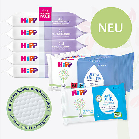 Verschiedene Babypflegeprodukte der Marke "Hipp", darunter eine Packung Babytücher, ein Babytuchspender und ein Babytuch.